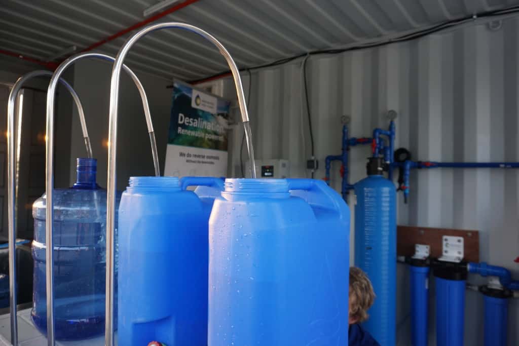Three water tanks inside the desalination container, which are being filled with the final product of the reverse osmosis desalination process: high quality drinking water.