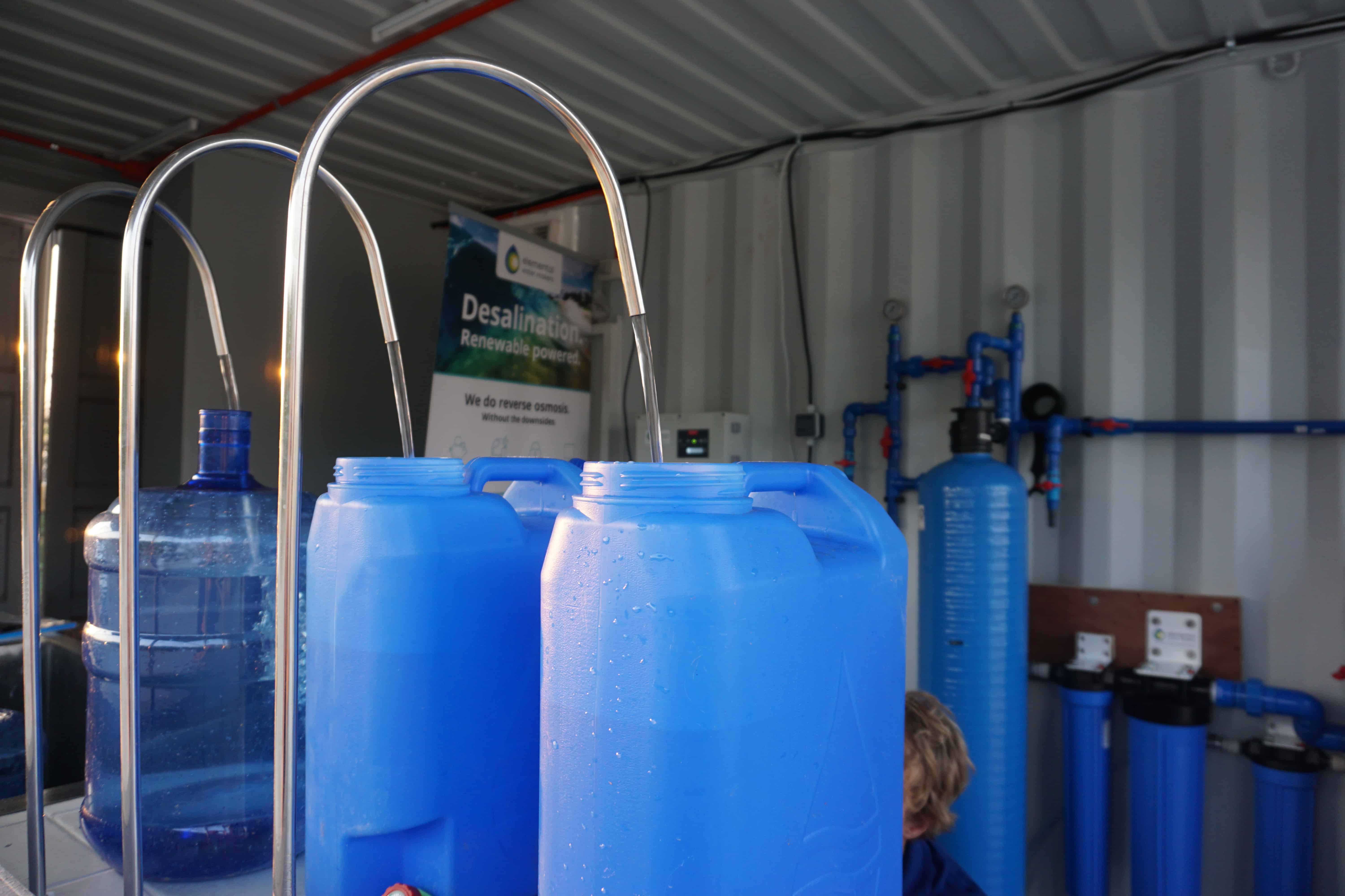 Three water tanks inside the desalination container, which are being filled with the final product of the reverse osmosis desalination process: high quality drinking water.