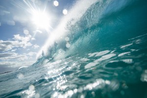 Turquoise-coloured breaking wave.