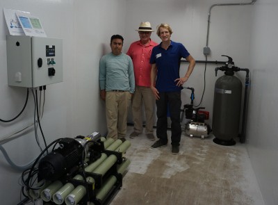 Happy customers Belize One of our owners (Reinoud Feenstra) next to two happy clients from Belize, who are exited to taste the purified water.