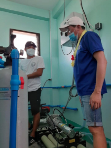 People talking inside the desalination unit